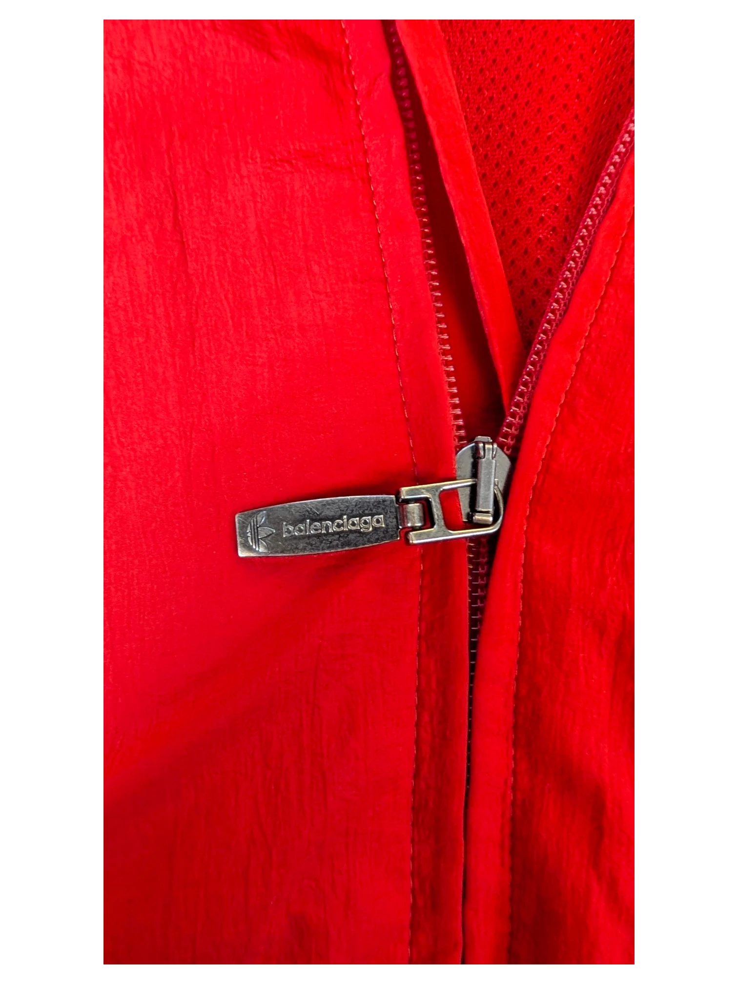 JAKE & IPI Balenciaga x Adidas red nylon jacket featuring a branded silver metal zipper pull