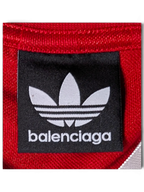 JAKE & IPI Balenciaga x Adidas red jersey featuring a black brand label with the iconic trefoil logo