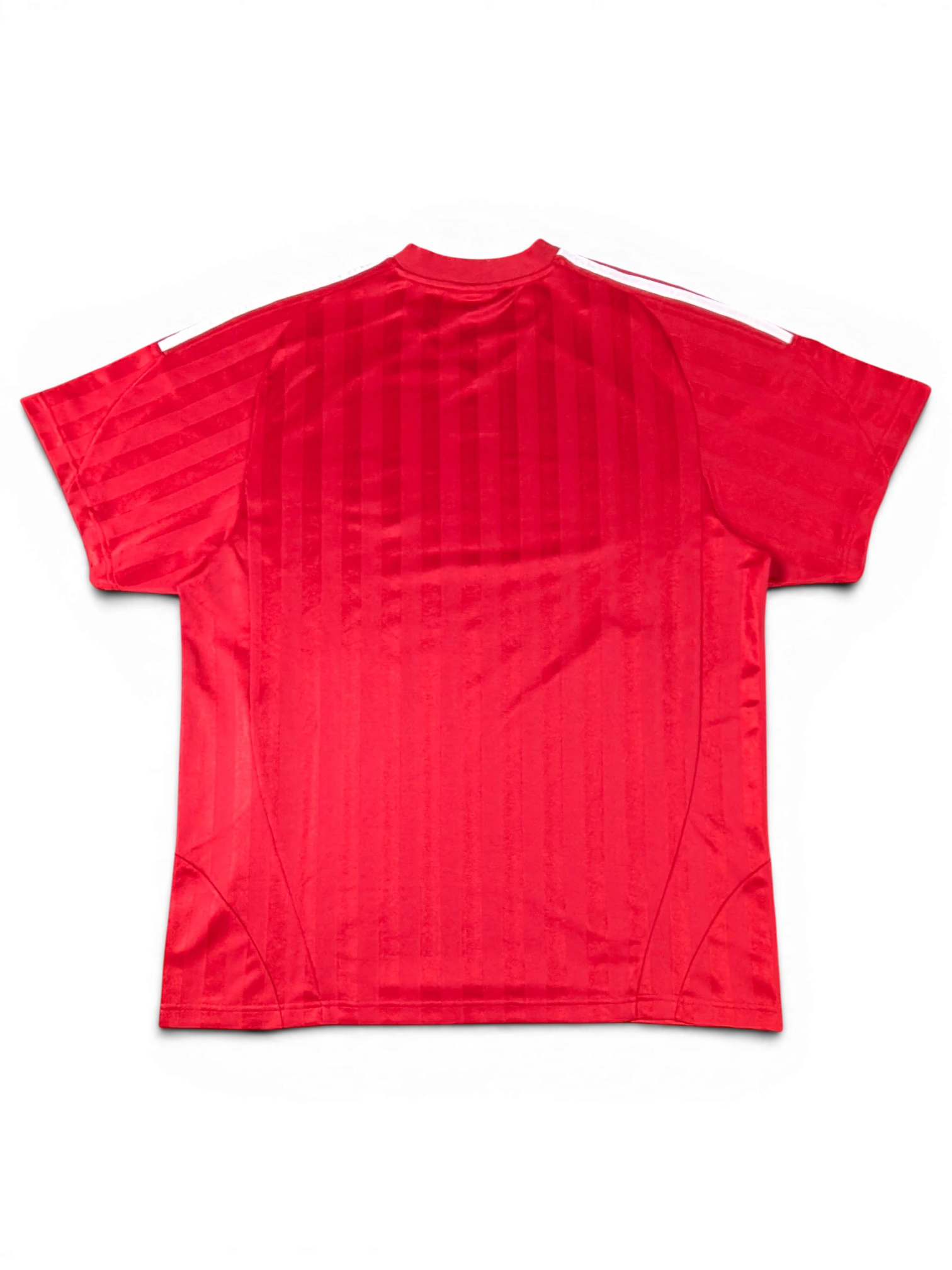 Back view of a red JAKE & IPI Balenciaga x Adidas jersey featuring vertical stripes and white shoulder stripes.