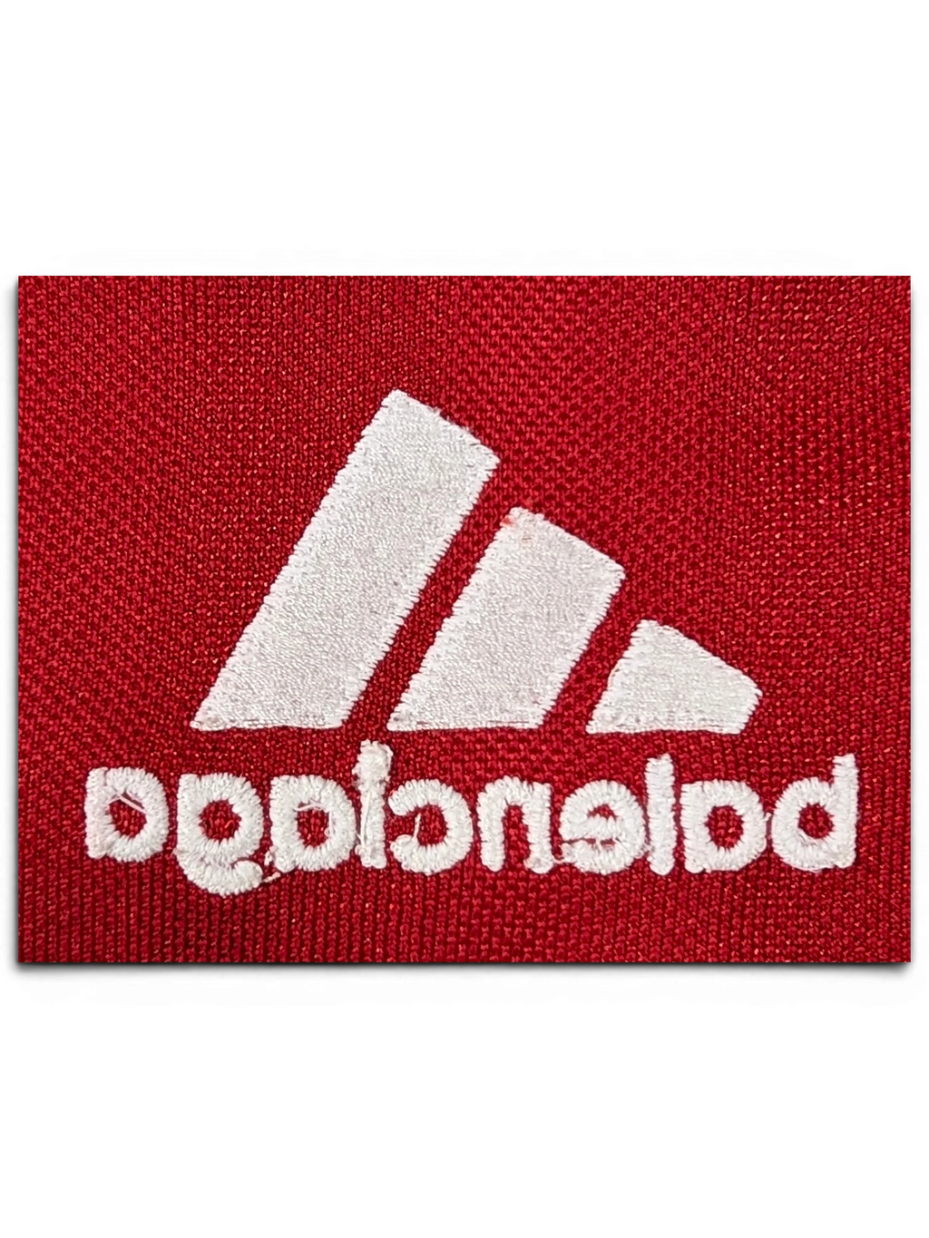 JAKE & IPI Balenciaga x Adidas red jersey featuring white embroidered logo detail