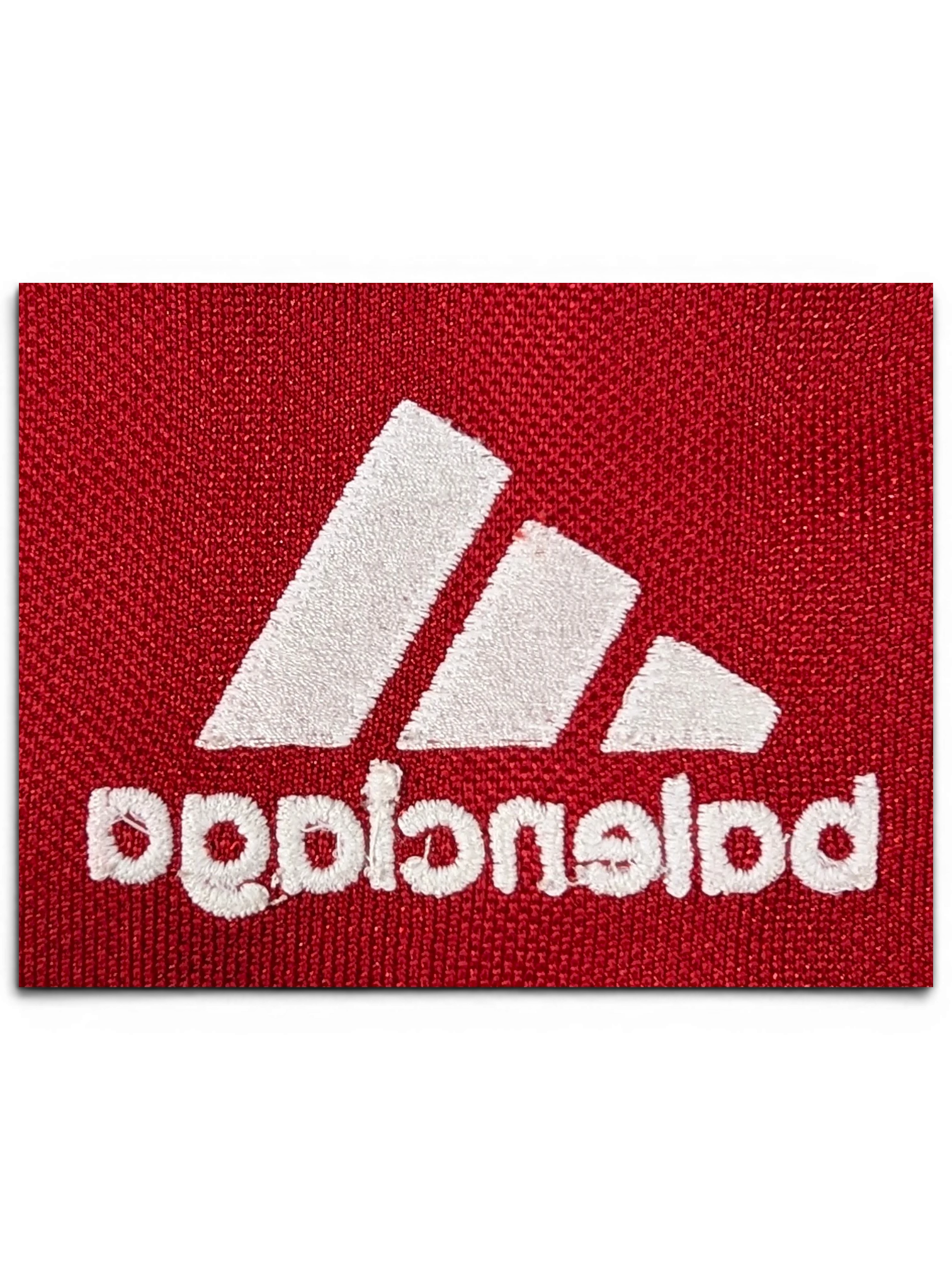 JAKE & IPI Balenciaga x Adidas red jersey featuring white embroidered logo detail