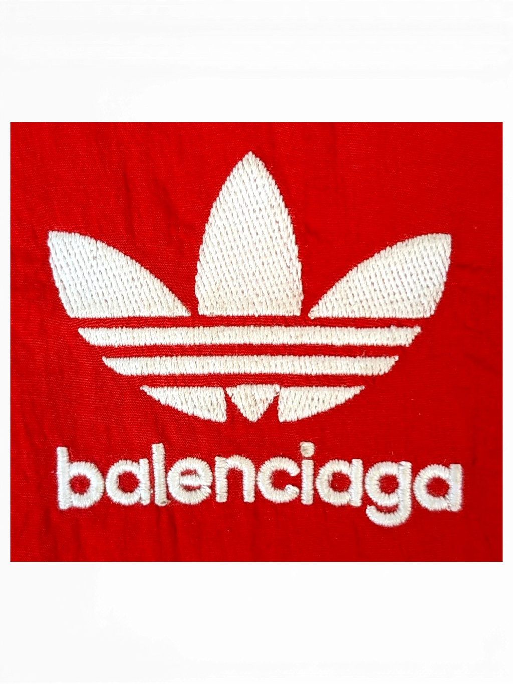 JAKE & IPI Balenciaga x Adidas collaboration red fabric with white embroidered trefoil logo and balenciaga text