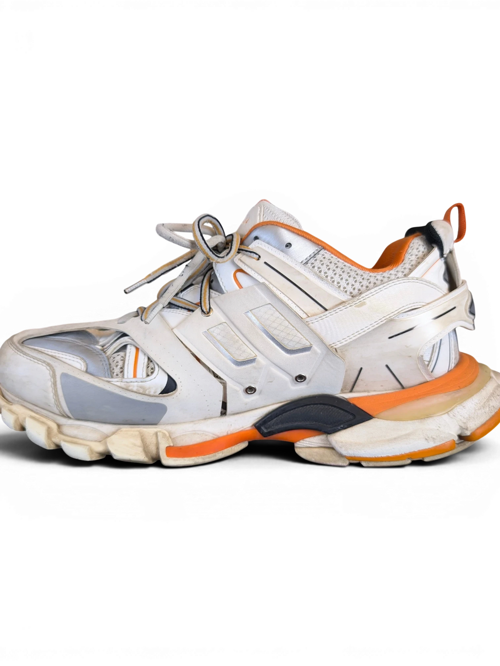 JAKE & IPI Balenciaga Track sneakers in white, grey, and orange with a layered, rugged design.
