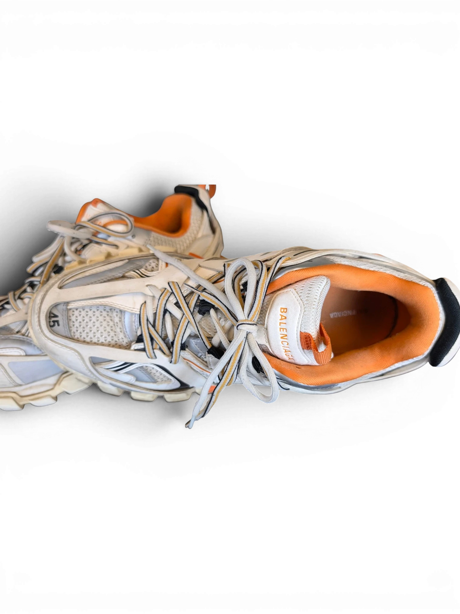 JAKE & IPI Balenciaga Track sneakers in white, grey, and orange with a layered, rugged design and size 45 detail.