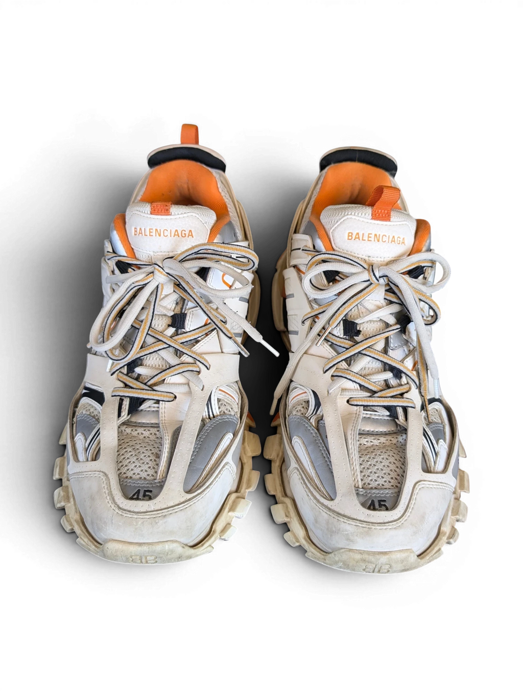 JAKE & IPI Balenciaga Track sneakers in white, grey, and orange with a rugged, layered design and size 45 detail.