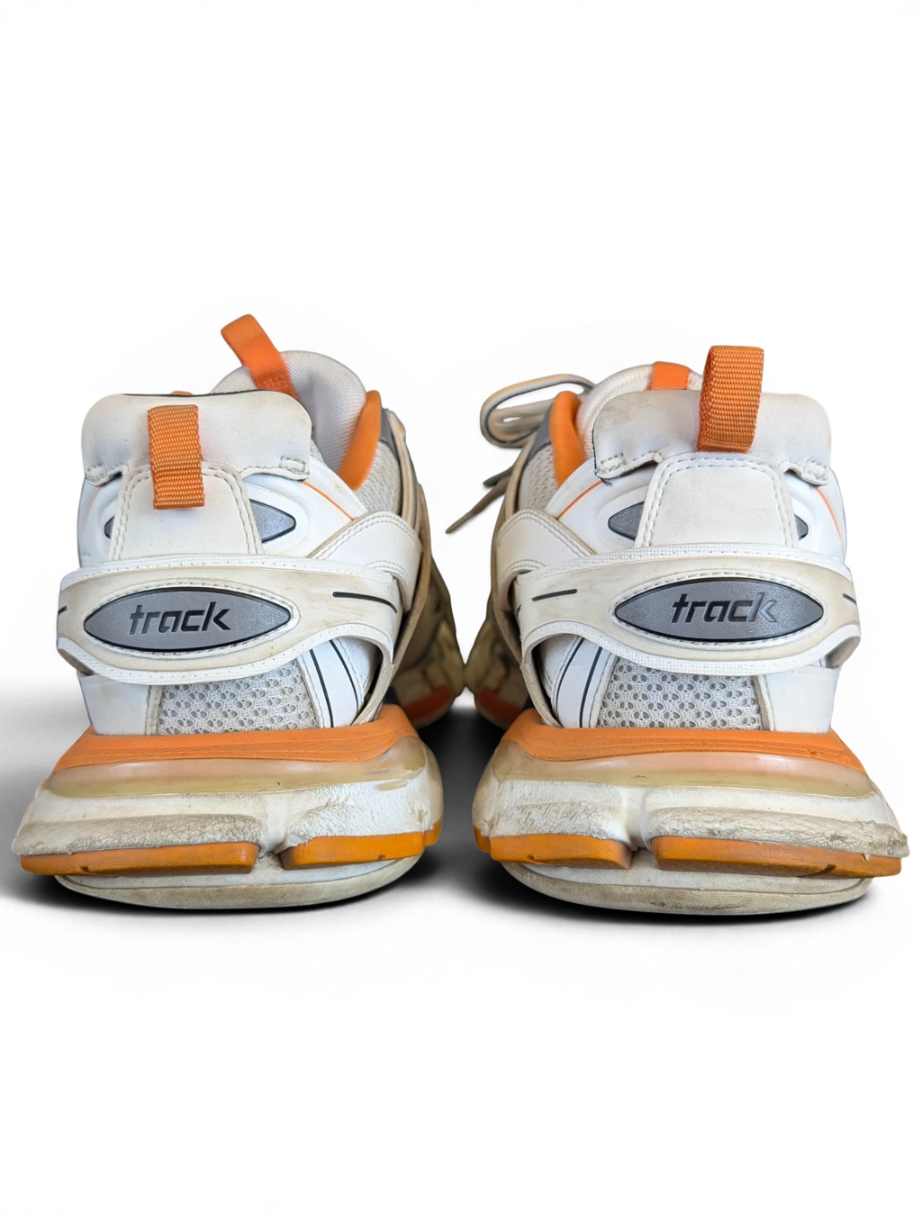 JAKE & IPI Balenciaga Track sneakers in white, grey, and orange with a layered, rugged design, rear view.
