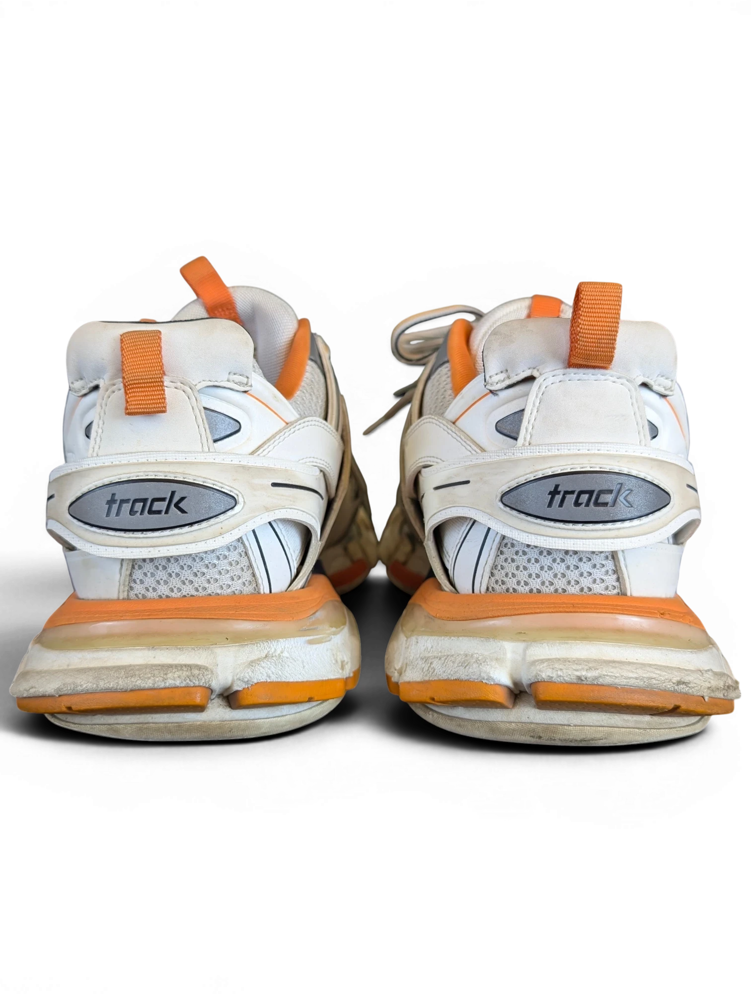JAKE & IPI Balenciaga Track sneakers in white, grey, and orange with a layered, rugged design, rear view.