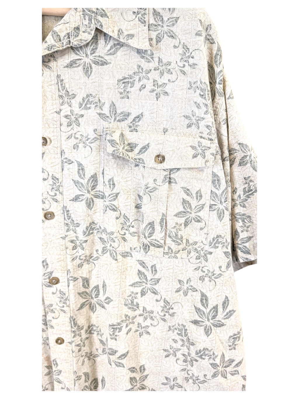 JAKE & IPI beige Hawaiian shirt with a grey floral print, featuring a button-down front and a chest pocket.