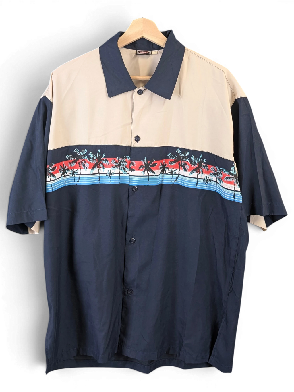 JAKE & IPI beige and navy blue short-sleeve Hawaiian shirt with a tropical palm tree print across the chest