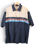JAKE & IPI beige and navy blue short-sleeve Hawaiian shirt with a tropical palm tree print across the chest