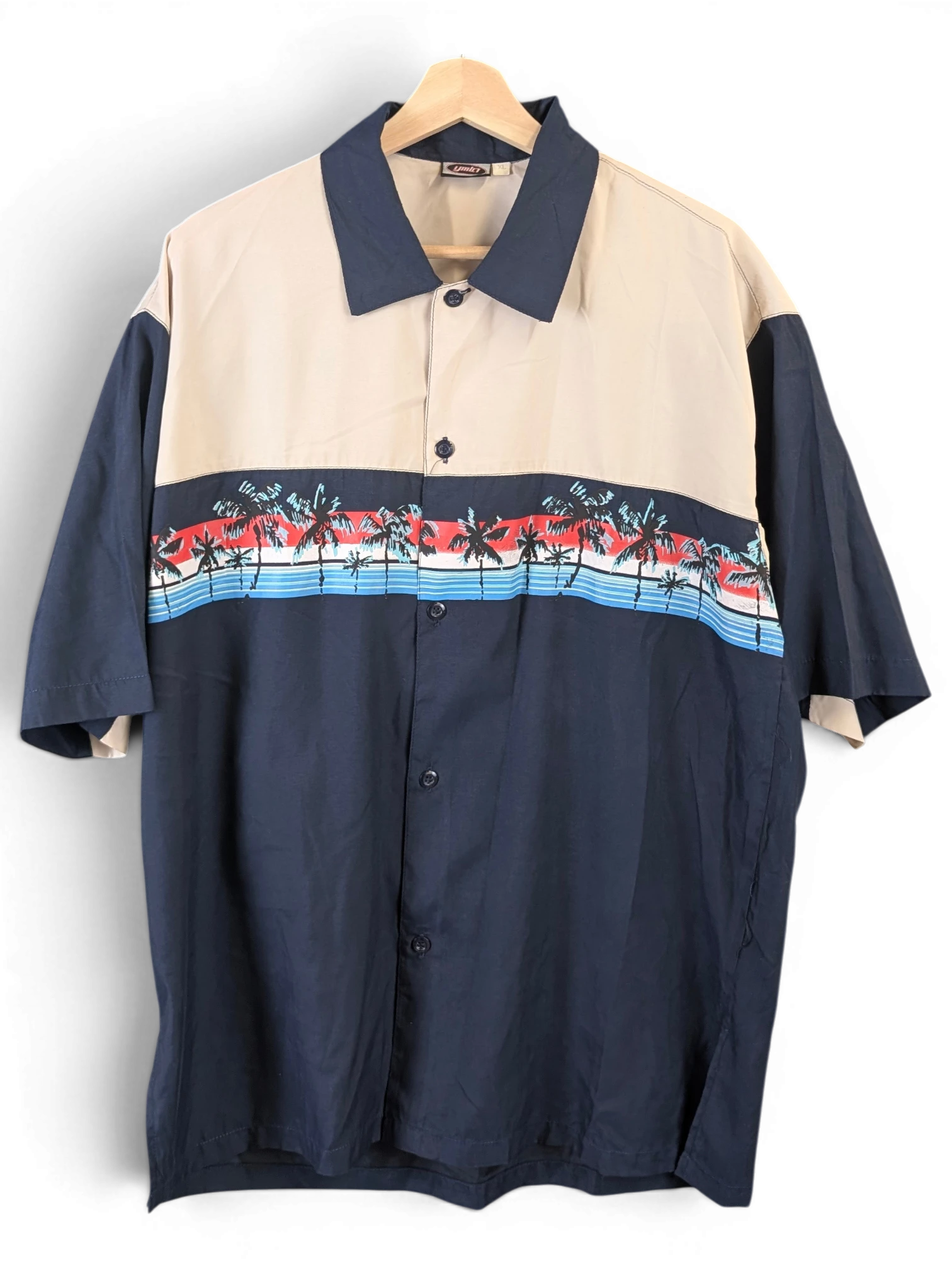 JAKE & IPI beige and navy blue short-sleeve Hawaiian shirt with a tropical palm tree print across the chest
