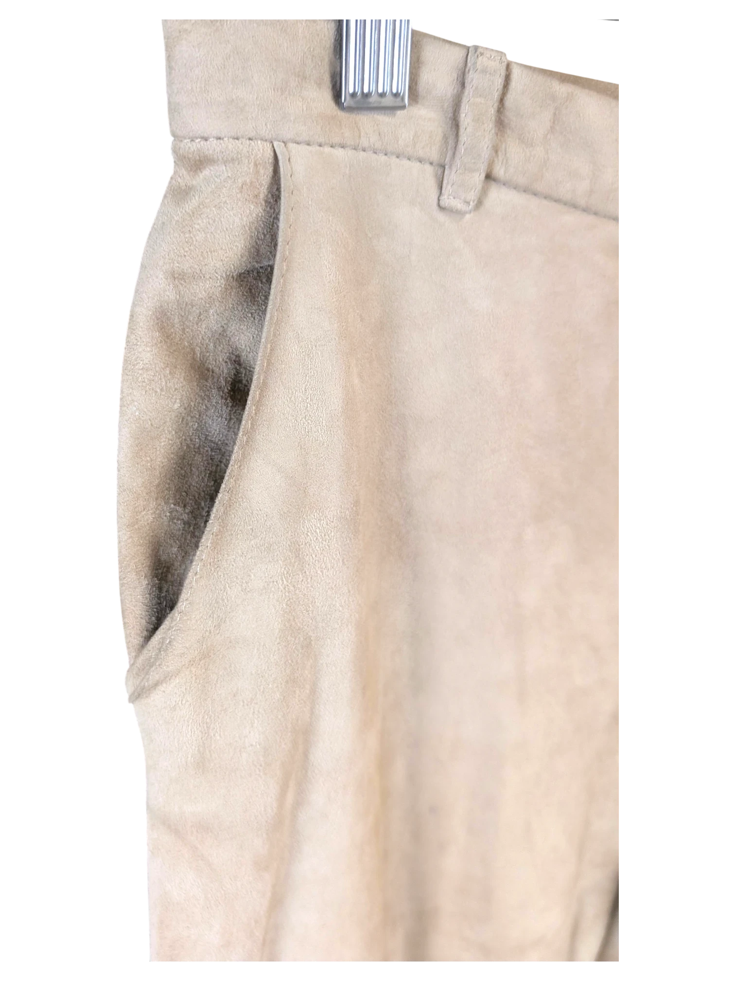JAKE & IPI beige suede leather pants featuring a side pocket and belt loops, hanging on a metal hanger.