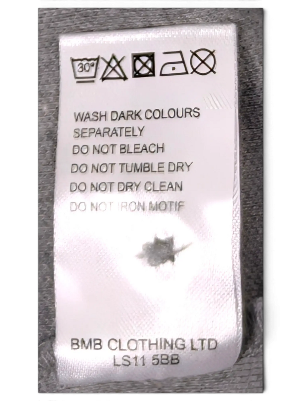JAKE & IPI Ben Sherman grey polo shirt care label with washing instructions and BMB Clothing Ltd details