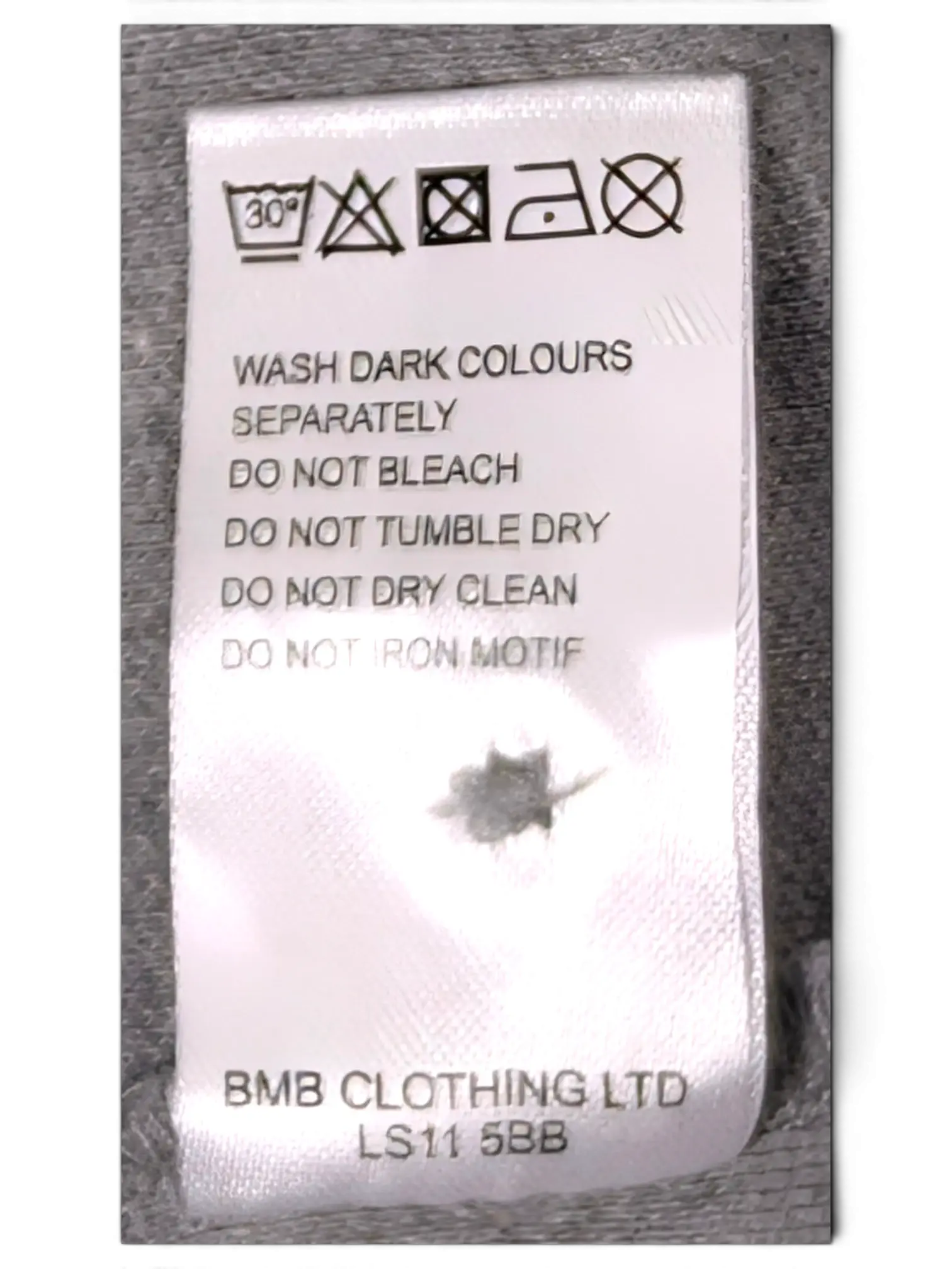 JAKE & IPI Ben Sherman grey polo shirt care label with washing instructions and BMB Clothing Ltd details