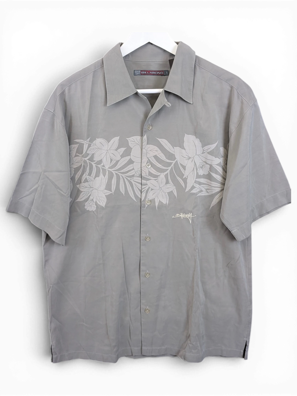 JAKE & IPI grey Billabong Hawaiian shirt with a subtle floral print and button-down front on a white hanger