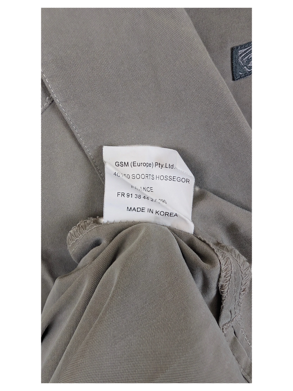 JAKE & IPI BillaBong Hawaiian shirt interior garment label showing manufacturing details and origin