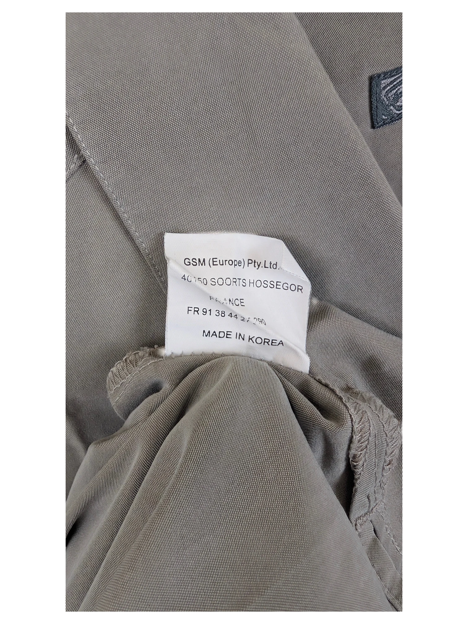 JAKE & IPI BillaBong Hawaiian shirt interior garment label showing manufacturing details and origin