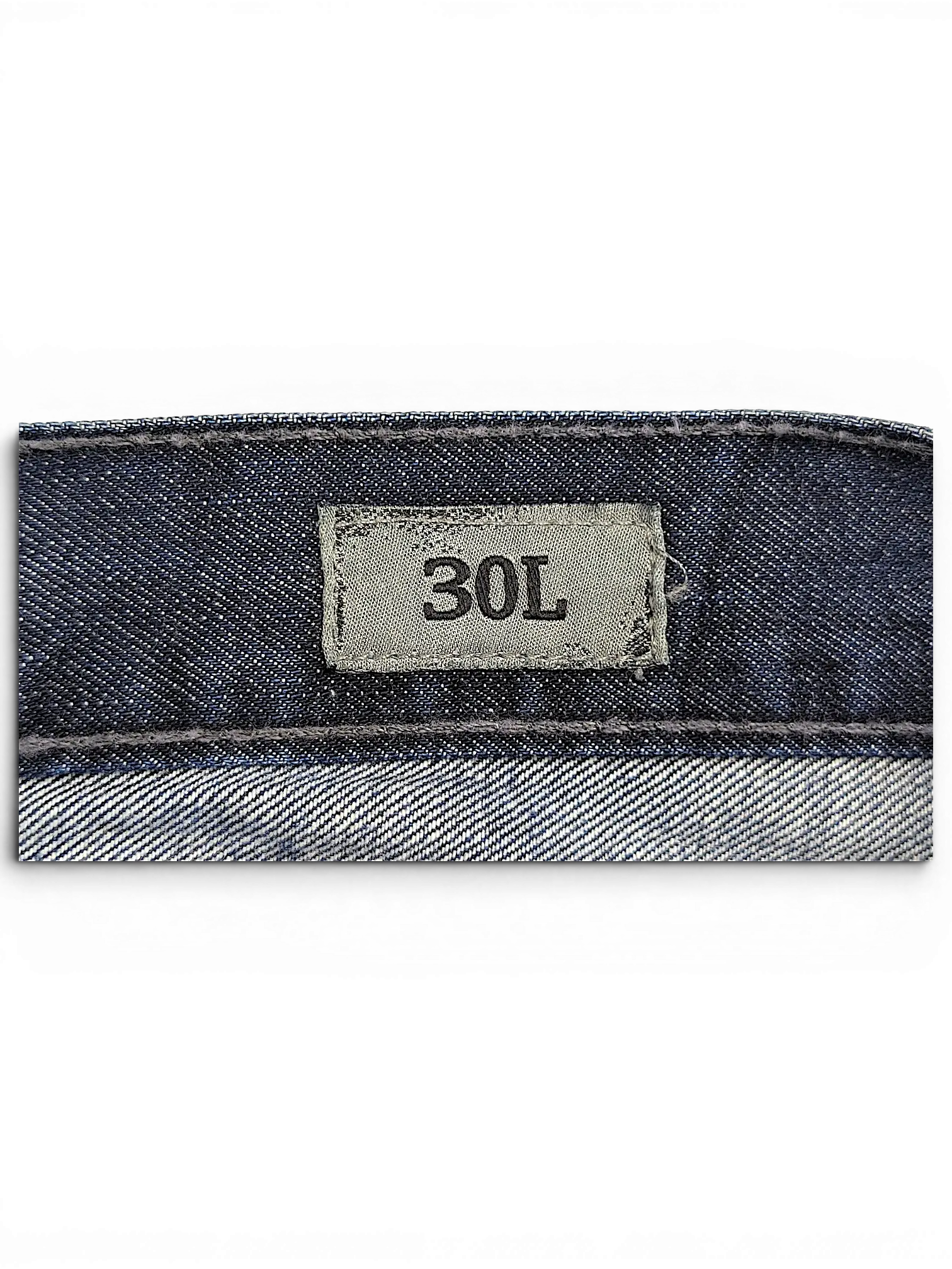 JAKE & IPI BKE Denim Carter jeans featuring a grey size tag showing 30L on the dark blue denim waistband.