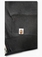 JAKE & IPI black Bape Shark hoodie sleeve featuring the iconic embroidered ape head logo patch on the ribbed cuff.