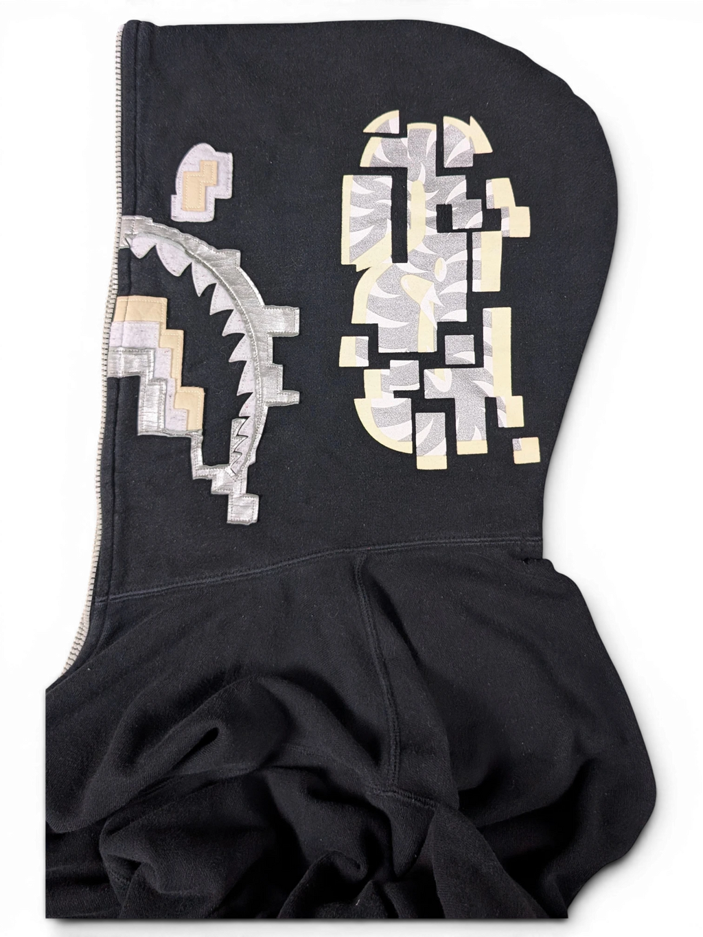 JAKE & IPI black Bape Shark hoodie featuring a pixelated graphic design on the hood and full-zip closure.