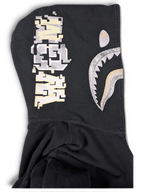 JAKE & IPI black cotton Bape shark hoodie with metallic silver and cream pixelated graphic details on the hood