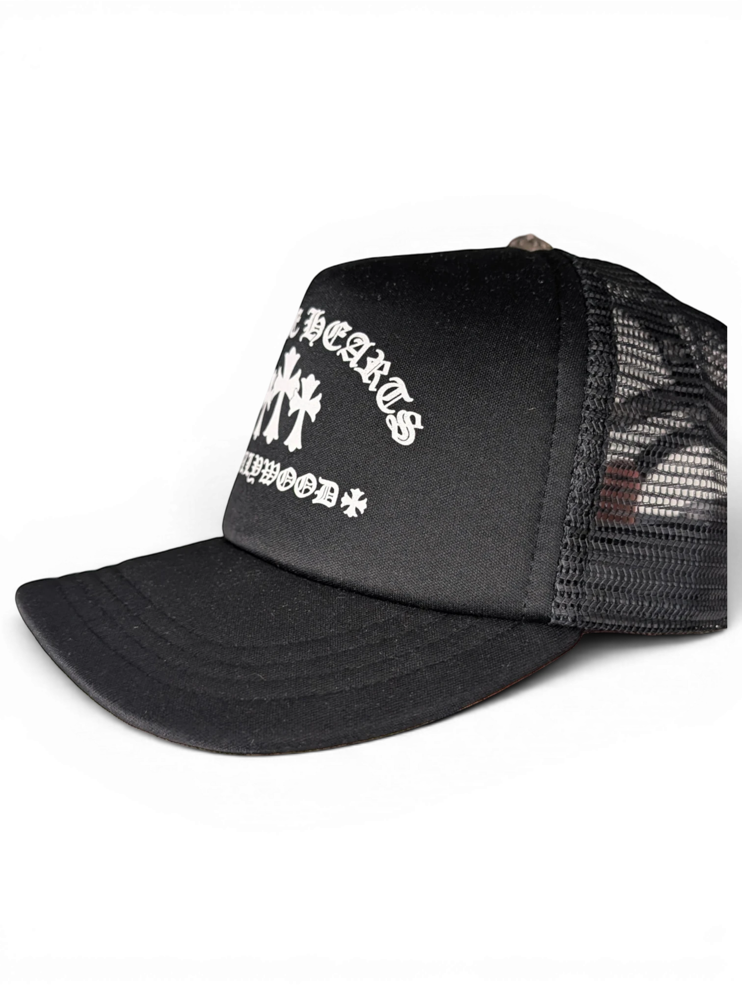JAKE & IPI black Chrome Hearts trucker hat with white gothic lettering and cross embroidery on the front panel