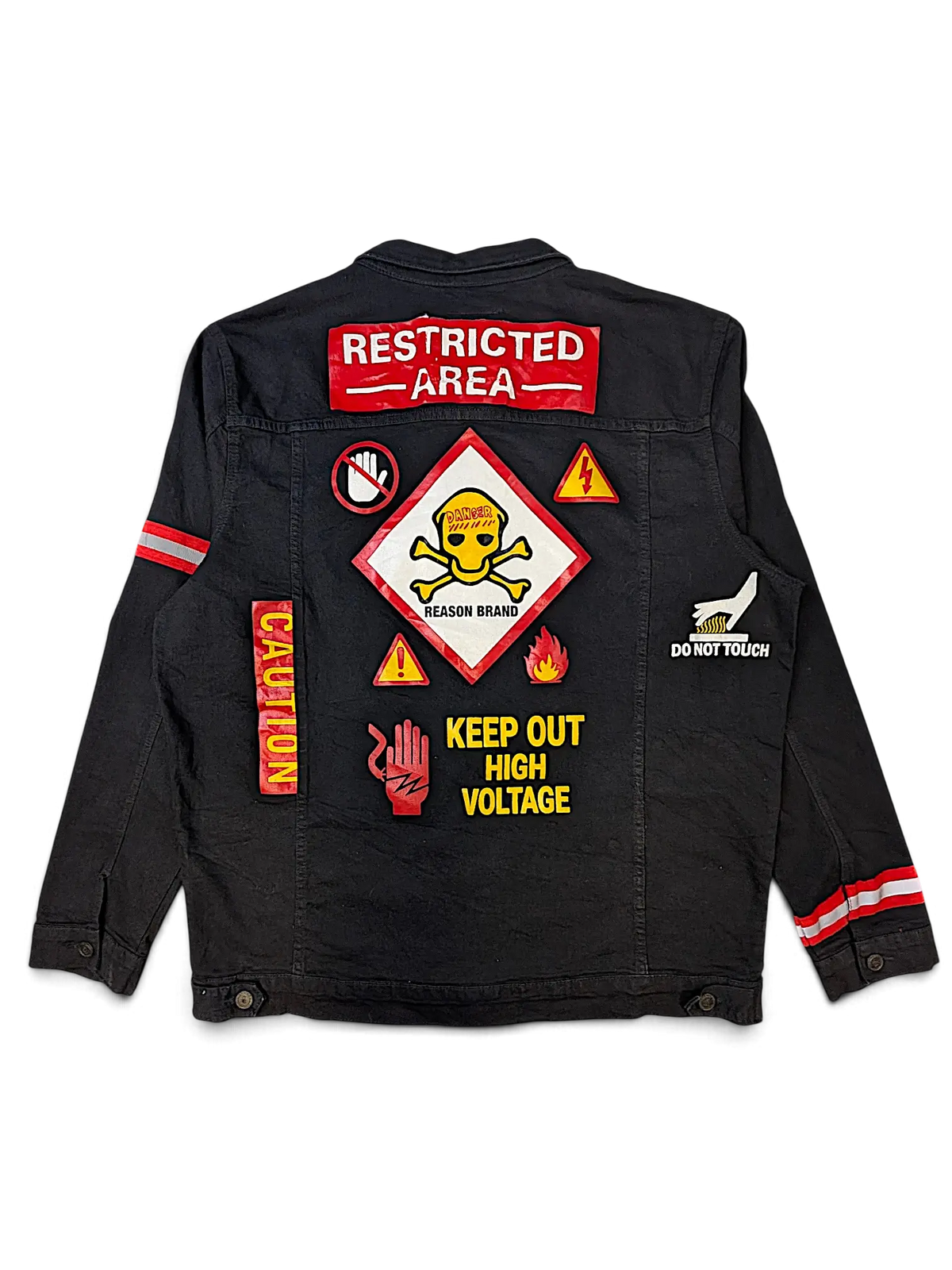 JAKE & IPI black denim jacket featuring various warning-themed patches on the back including Restricted Area and Danger.