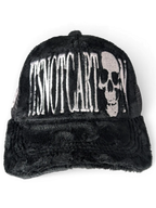 JAKE & IPI black faux fur trucker cap featuring white embroidered Itsnotcartoon text and a skull graphic