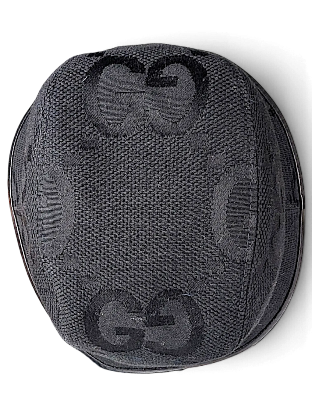 JAKE & IPI black canvas bucket hat featuring the iconic Gucci GG monogram pattern viewed from above