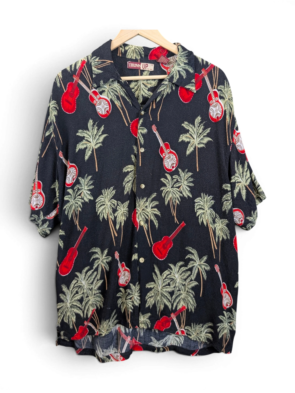 JAKE & IPI black Hawaiian shirt featuring a tropical palm tree and red guitar print with a classic collar