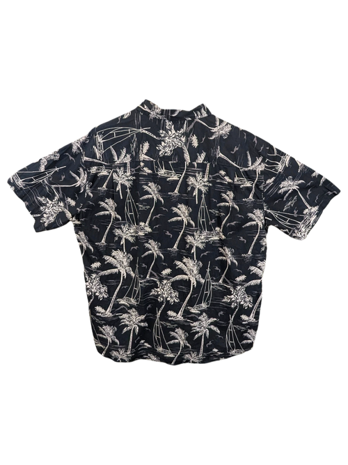 JAKE & IPI black short-sleeve Hawaiian shirt with white palm tree and sailboat print on a wooden hanger