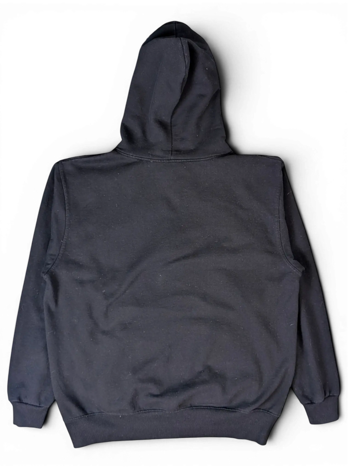 Back view of a plain black JAKE & IPI hoodie with a hood, isolated on a black background.