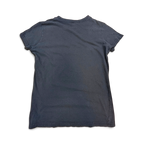 JAKE & IPI black crew neck t-shirt with Janelle Monàe branding, shown from the back with a store tag attached.