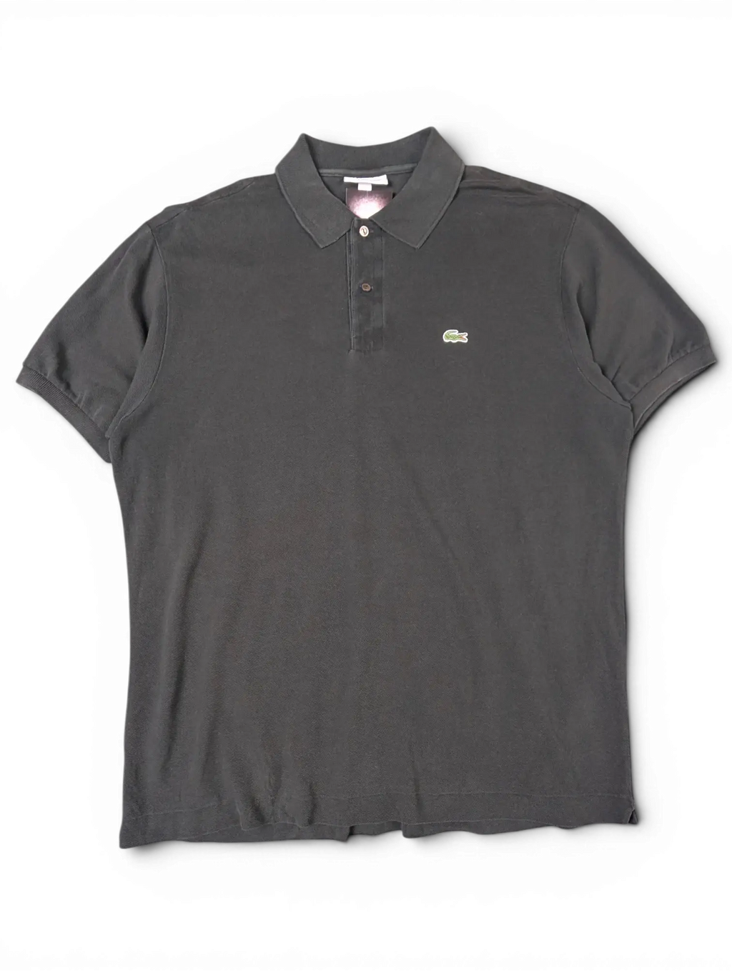JAKE & IPI black Lacoste polo shirt with a classic collar, three-button placket, and signature green crocodile logo.