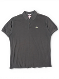 JAKE & IPI black Lacoste polo shirt with a classic collar, three-button placket, and signature green crocodile logo.