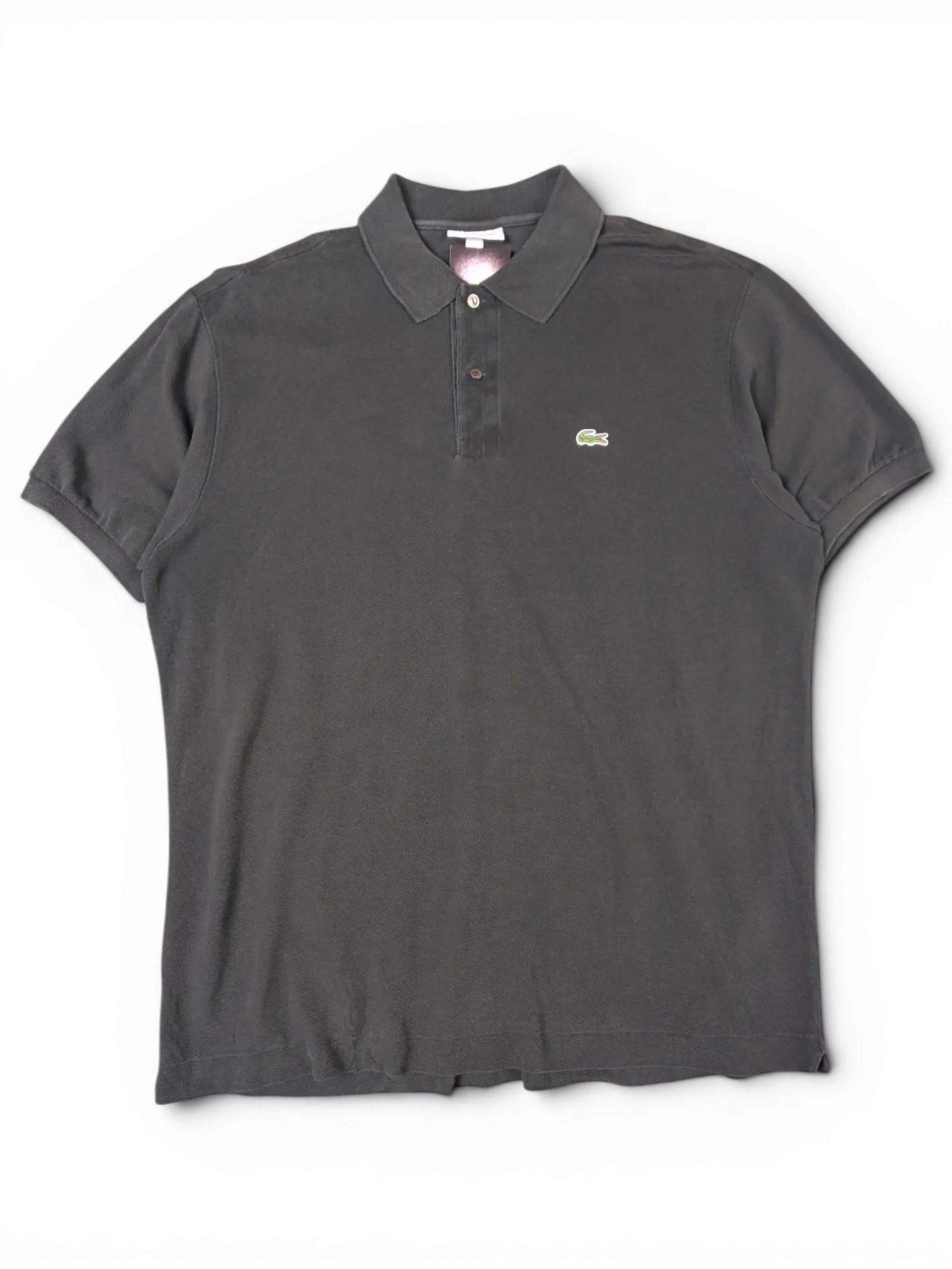 JAKE & IPI black Lacoste polo shirt with a classic collar, three-button placket, and signature green crocodile logo.