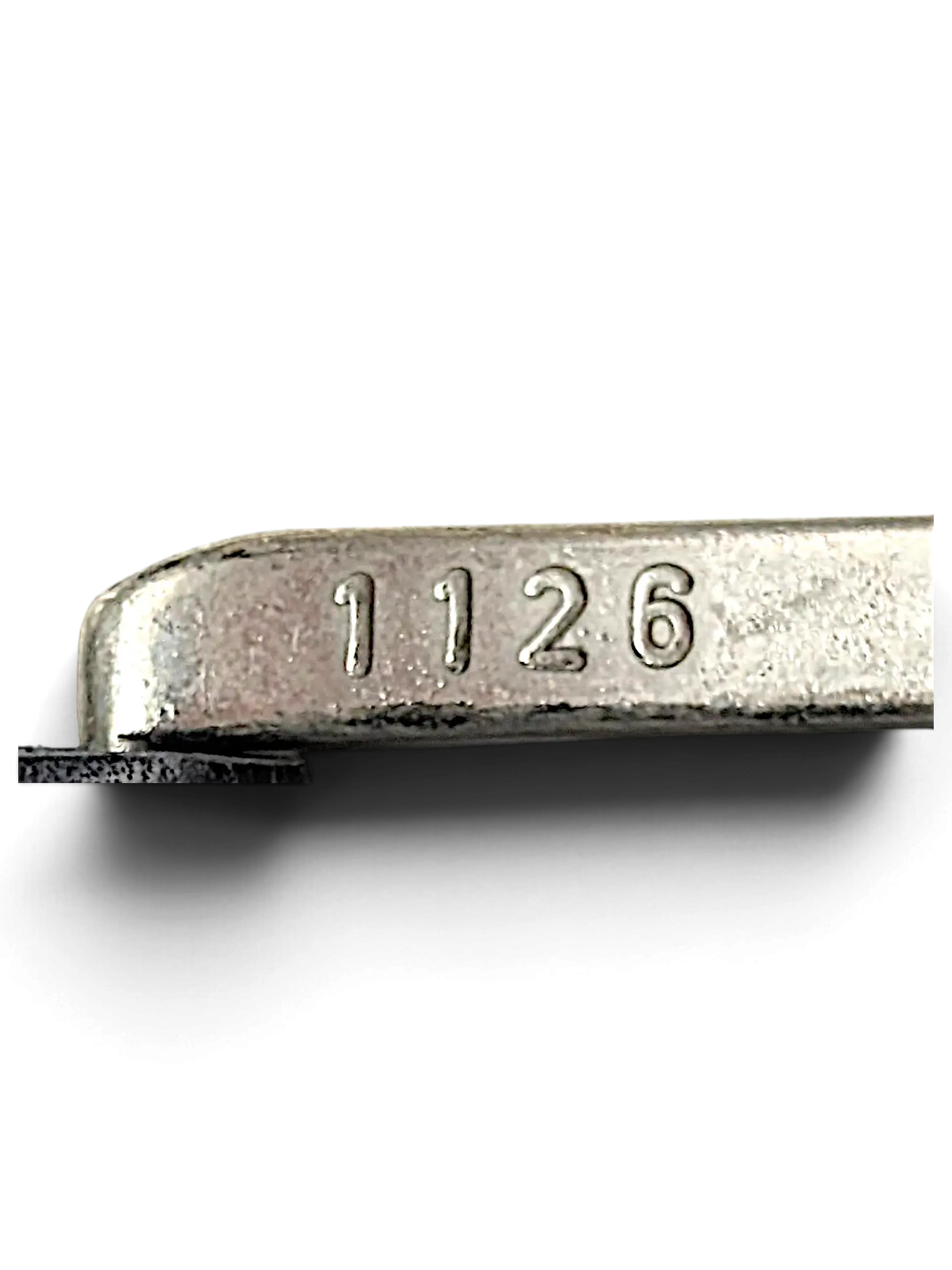 JAKE & IPI The Art Of Belt featuring a black leather strap and a silver metal buckle engraved with the number 1126.