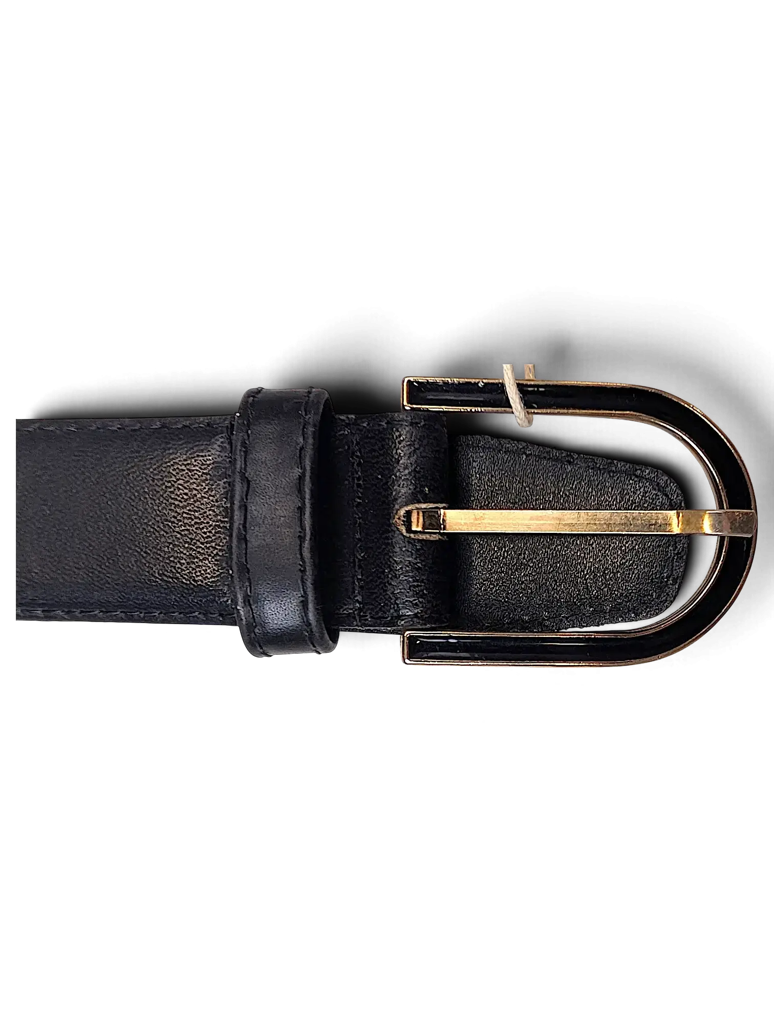 JAKE & IPI black leather belt featuring a gold and black metal buckle against a dark background