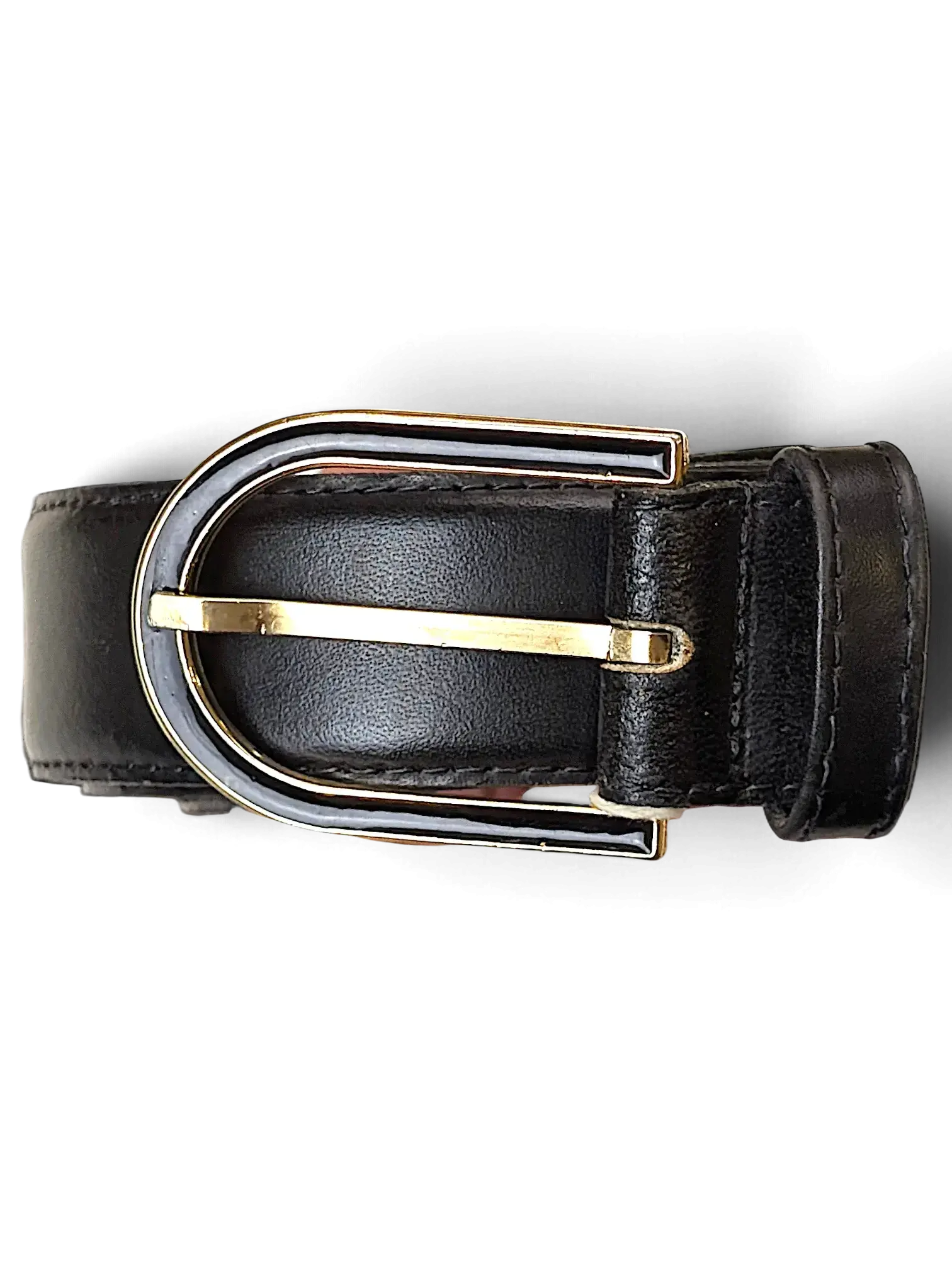 JAKE & IPI black leather belt featuring a unique gold and black metal buckle held in a hand with a store tag.