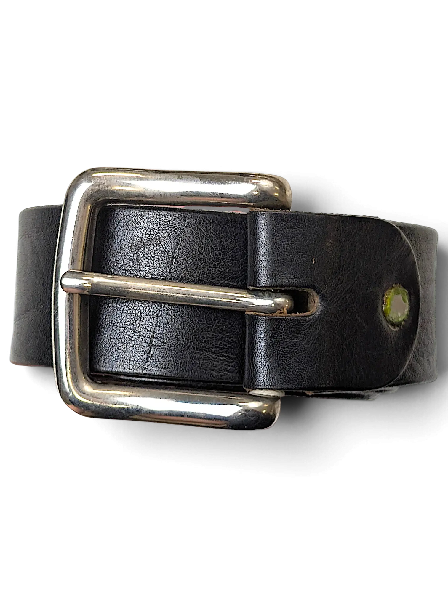 JAKE & IPI black leather belt with a polished silver-tone metal buckle held in a hand