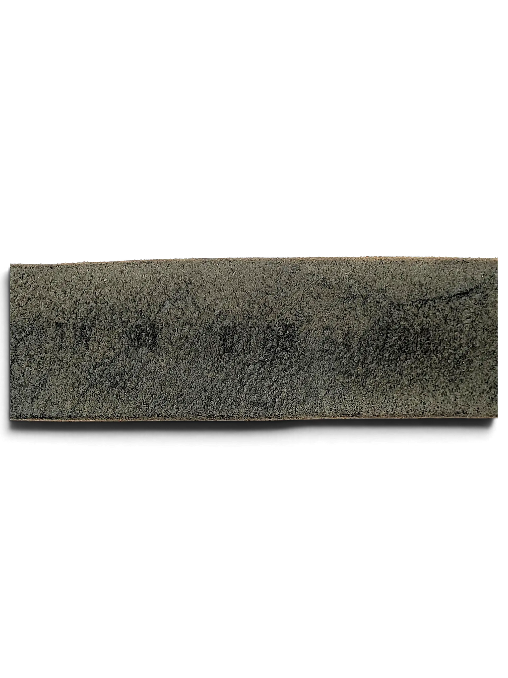 Close-up of the textured black leather surface of a JAKE & IPI B.Belt showing natural grain and material quality.