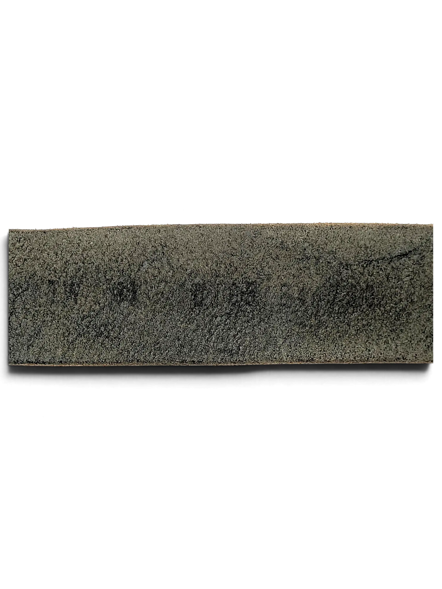 Close-up of the textured black leather surface of a JAKE & IPI B.Belt showing natural grain and material quality.