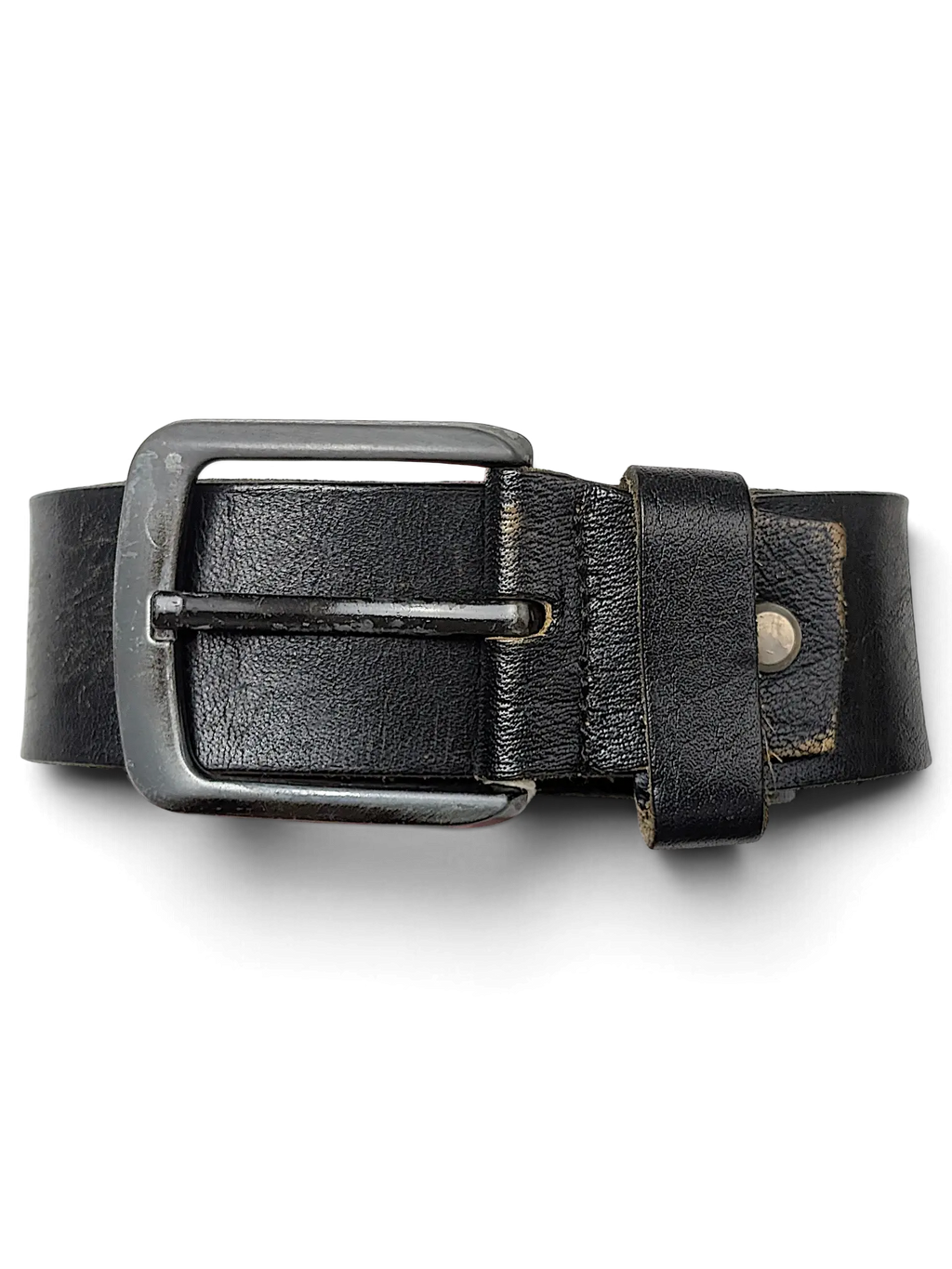 JAKE & IPI black leather belt with a silver metal buckle held by a hand against a black background