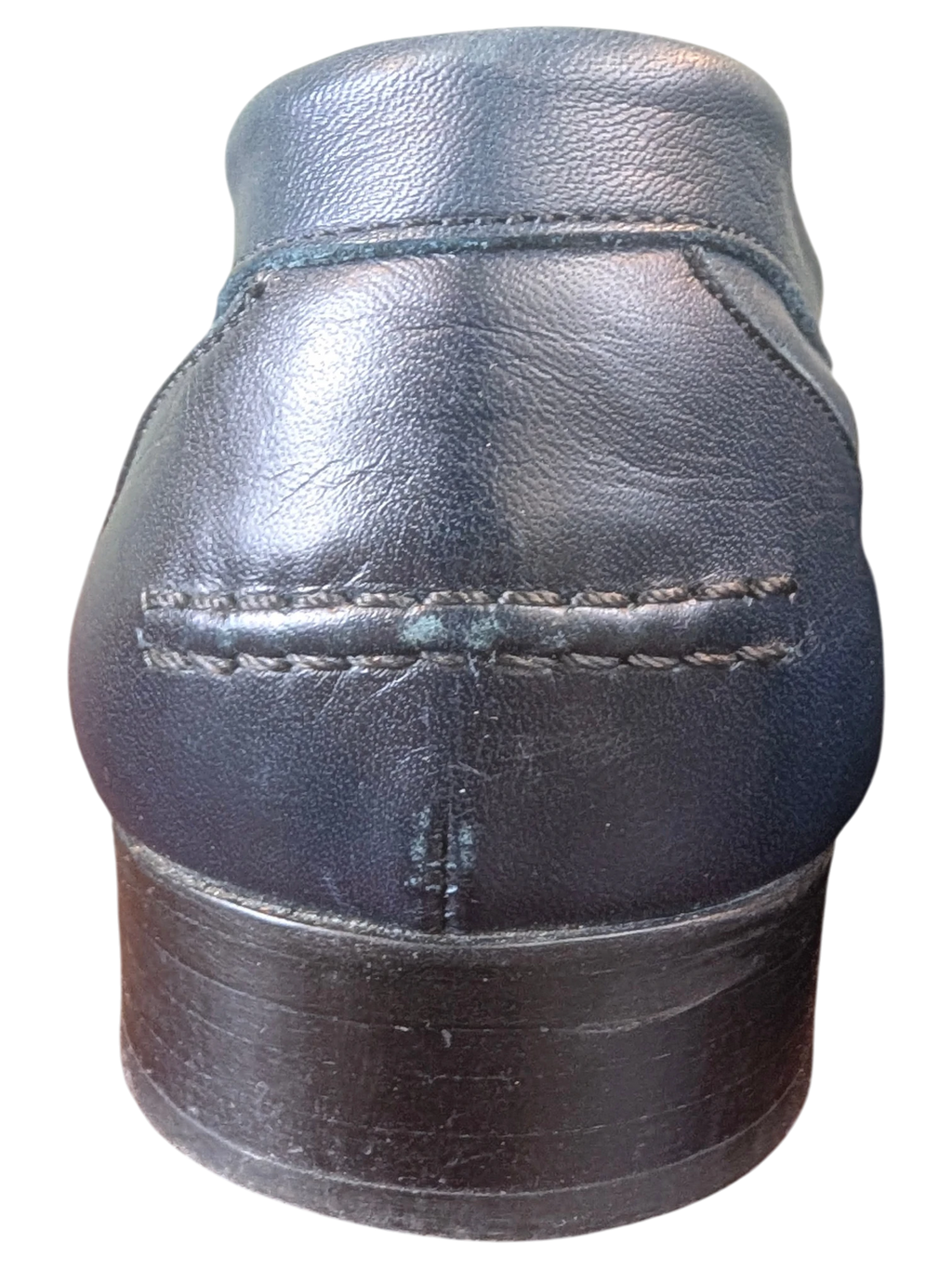 Rear view of JAKE & IPI black leather loafers featuring detailed stitching on the heel counter.