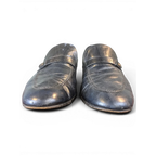 JAKE & IPI black leather loafers with a classic strap detail and textured finish, front view.