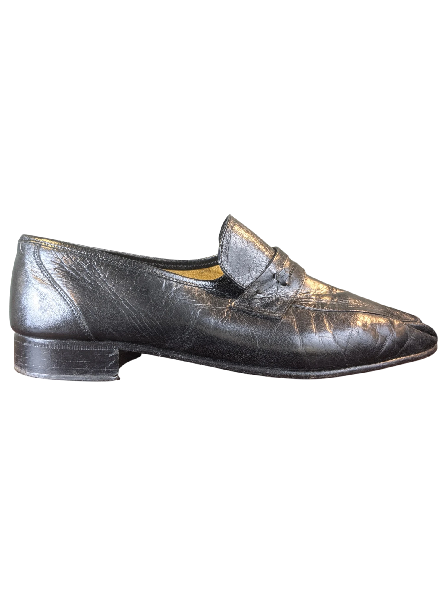 JAKE & IPI black leather penny loafers with a classic slip-on design and low heel, side view.