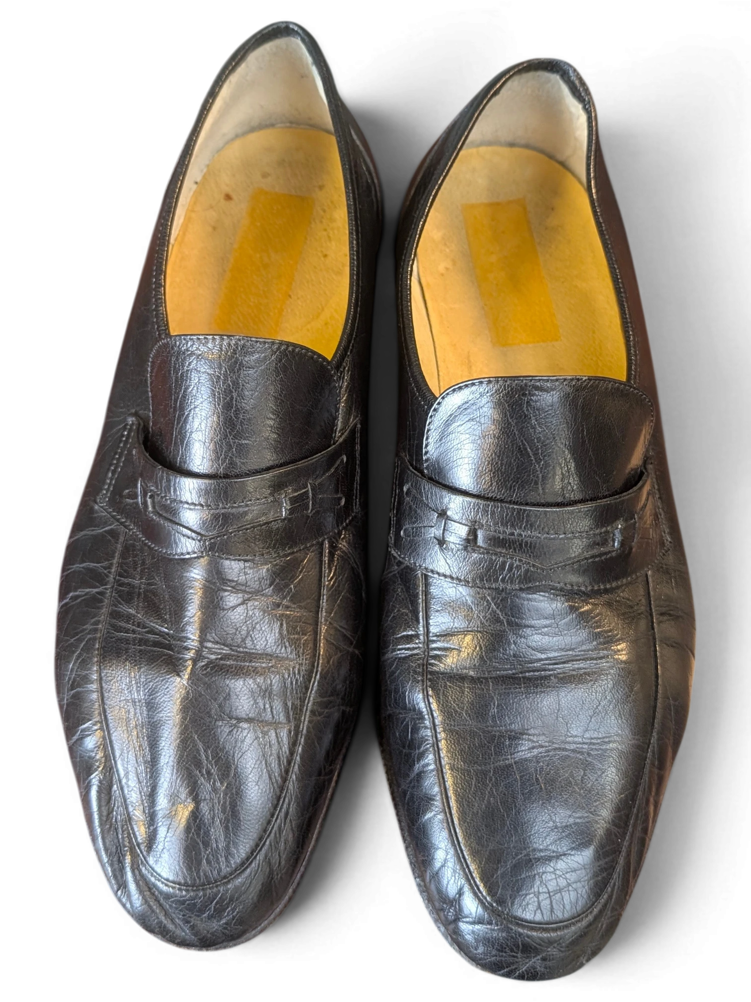 JAKE & IPI black leather penny loafers with a classic slip-on design and textured finish