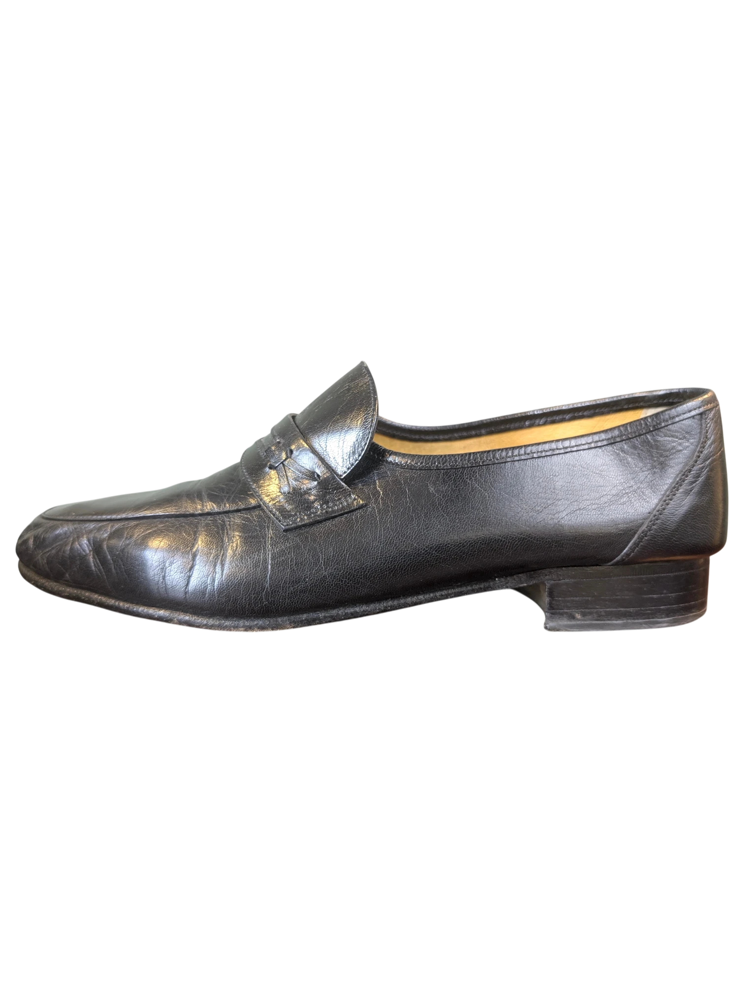 JAKE & IPI black leather loafers with a classic penny strap design and low stacked heel, side profile view.