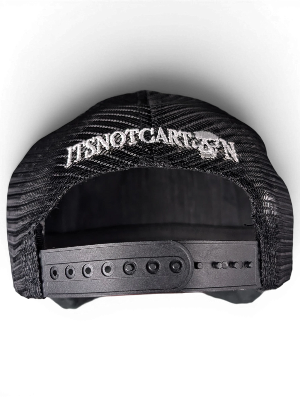JAKE & IPI black mesh snapback cap featuring white ITSNOTCARTOON embroidery with a skull detail on the back