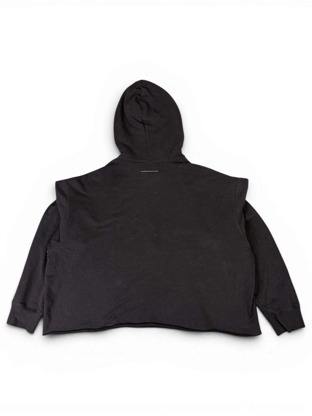 JAKE & IPI black MM6 Lunar New Year hoodie, back view showing oversized fit and raw hem detail.